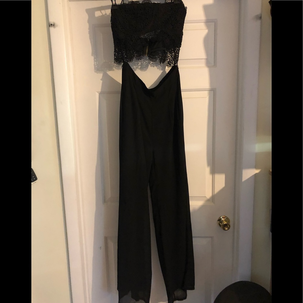 Black strapless body suit.